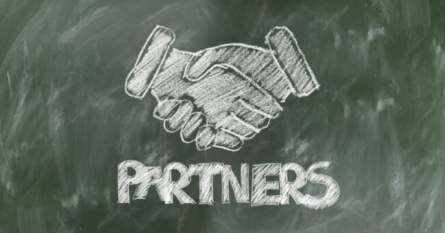partners shaking hands